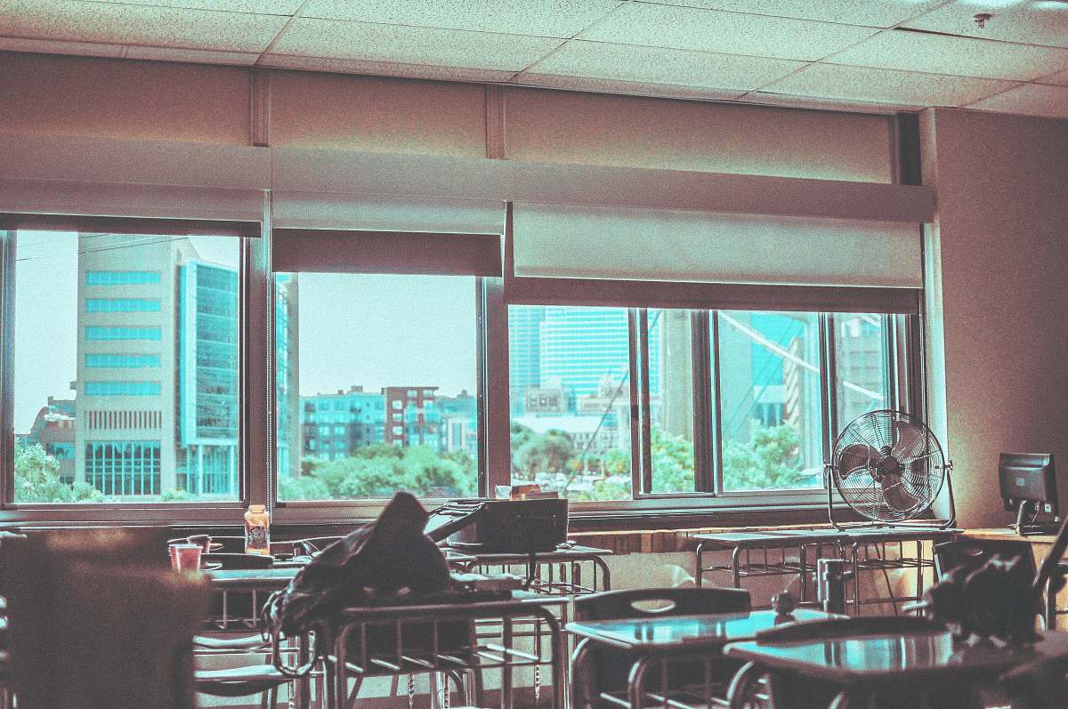 delasalle highschool round gray fan on table near window minneapolis